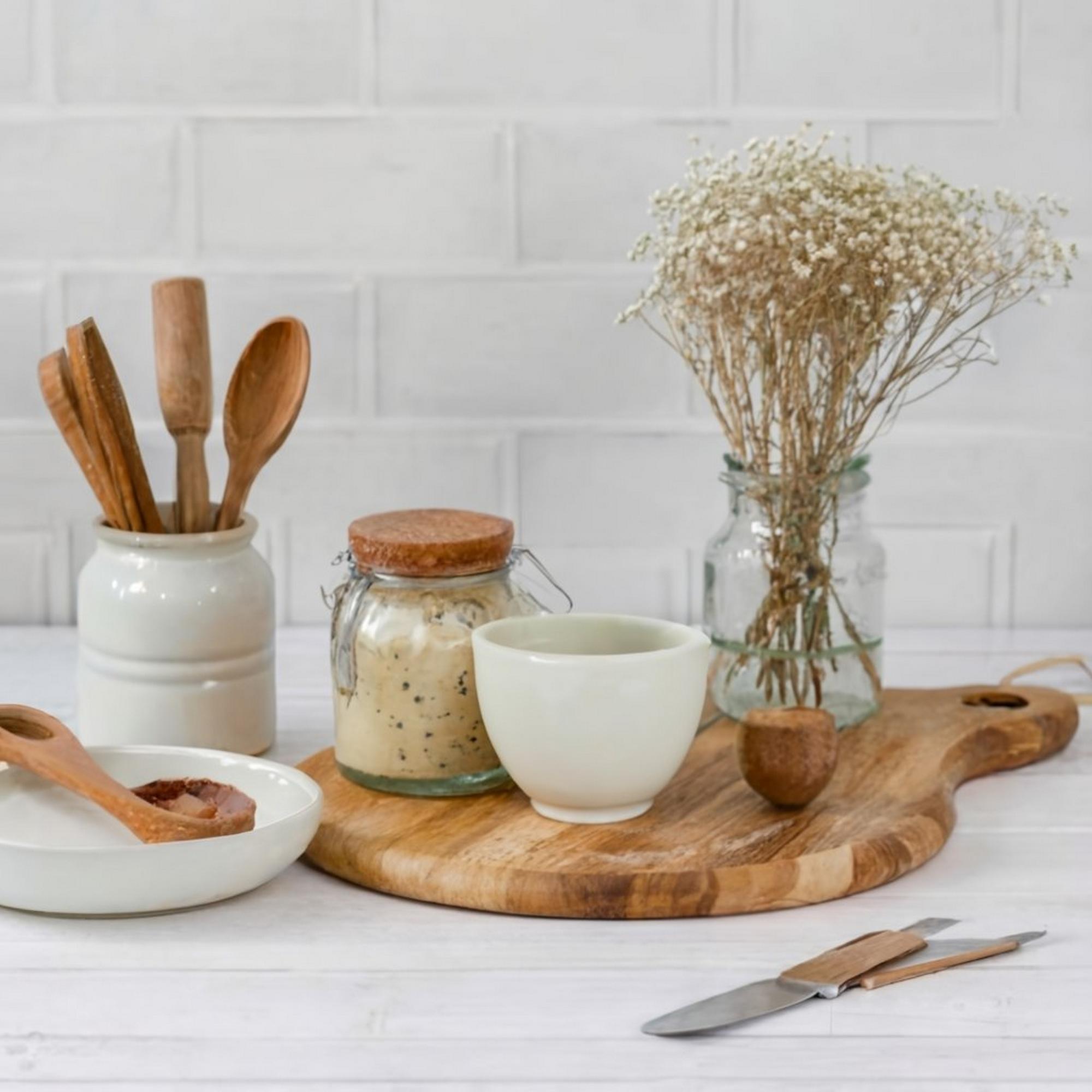 Kitchen workspace with jars and utensils
